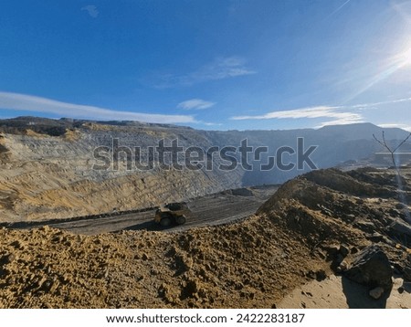 Big copper mine in eastern Serbia. Heavy duty dumper in mining industry. Royalty-Free Stock Photo #2422283187