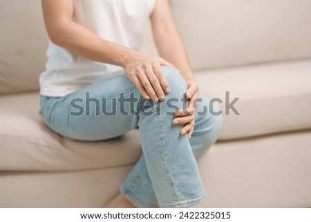 woman having knee ache and muscle pain due to Runners Knee or Patellofemoral Pain Syndrome, osteoarthritis, arthritis, rheumatism and Patellar Tendinitis. medical concept Royalty-Free Stock Photo #2422325015