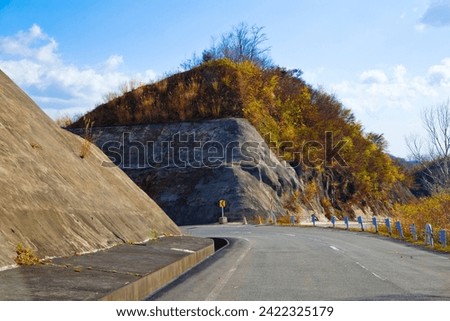 The road through Mt. kurikoma area geopark, Iwate prefecture, Tohoku, Japan. Royalty-Free Stock Photo #2422325179