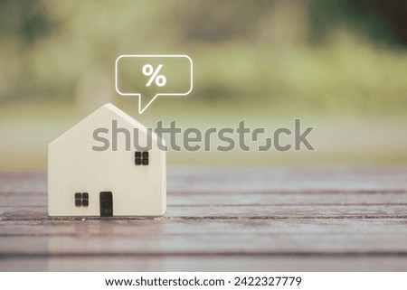 Housing Finance, Refinance to reduce the interest of home loan. Mortgage, loan, repayments, credit limit, house tax, business and financial concept. House model and percentage sign on text message. 