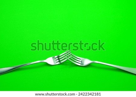 Fork set together isolated on green background, Food concept photography, Cutlery sets on green screen background, Copy space, No people 