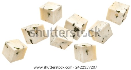 Falling feta cubes isolated on white background