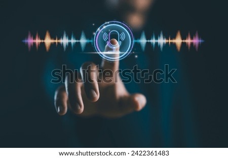 Voice recording. Man touching microphone icon on smartphone. Mobile application record sound, audio, music, voice message or use your voice to direct AI to search for information on Internet. Royalty-Free Stock Photo #2422361483