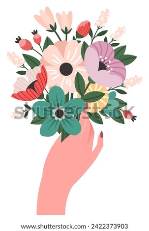 bouquet of flowers in a woman's hand