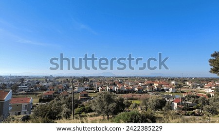 blue sky and houses in village  Royalty-Free Stock Photo #2422385229