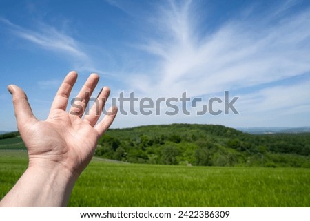 Male hand in the countryside 