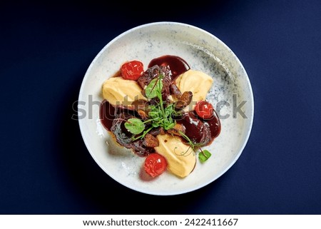Stewed veal cheeks with mashed potatoes and vegetables Royalty-Free Stock Photo #2422411667