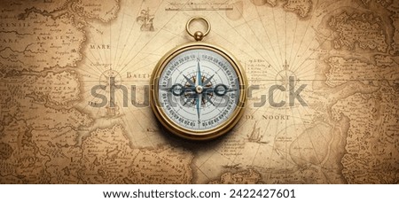 Magnetic old compass on world map. Travel, geography, history, navigation, tourism and exploration concept background. Retro compass on geography map. Royalty-Free Stock Photo #2422427601