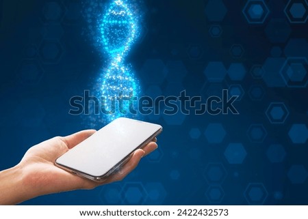 Close up of female hand holding smartphone with glowing DNA helix on blurry blue background. Medical and heredity genetic health concept. Technology science