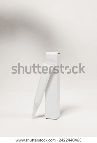 Elegant cosmetic tube and box mockup on white background