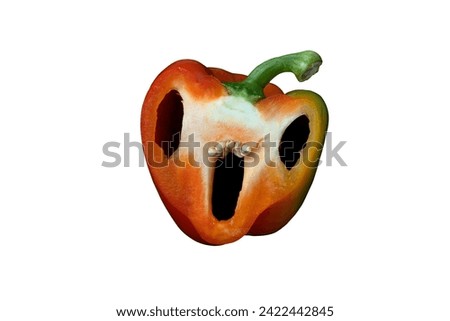 Creepy Halloween pepper face with big eyes and mouth on a white background. Holiday Red Pepper Troll Craft