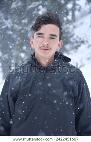 Picture of teenager traveller, photo of Indian adult boy with snow backround