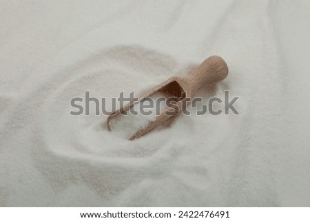 Pile of gluconolactone, close-up. Glucono Delta-Lactone, Pure GDL in wooden scoop. White powder, oxidized derivative of glucose. Food additive E575.
