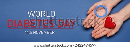 World Diabetes Day. Woman holding light blue paper circle and decorative red heart on color background, top view. Banner design