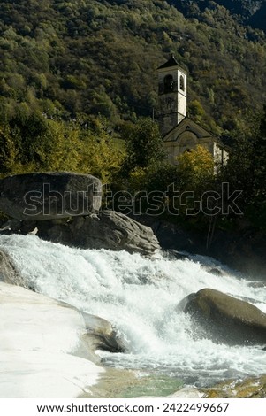 a waterfall in the river, swiss village
