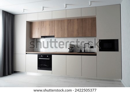 Modern built-in kitchen in minimalist style Royalty-Free Stock Photo #2422505377
