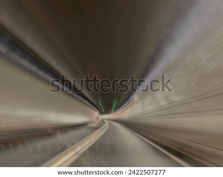 A car Speeding through the tunnel