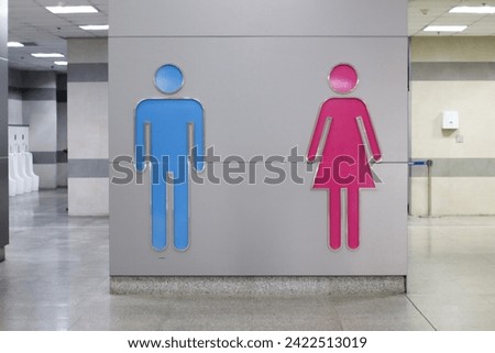 Area in front of the bathroom There is a clear symbol separating the men's and women's restrooms.