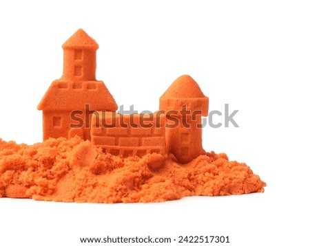 Castle figures made of orange kinetic sand isolated on white Royalty-Free Stock Photo #2422517301