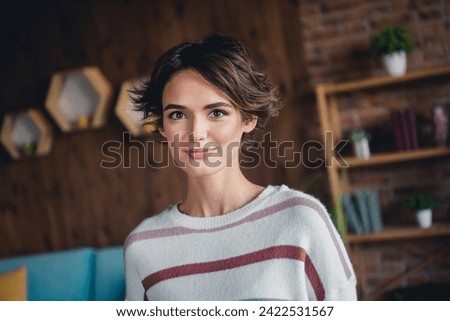Photo of adorable satisfied glad young girl good mood enjoy spend free time weekend comfy house indoors Royalty-Free Stock Photo #2422531567
