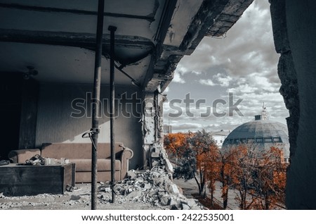destroyed and burned houses in the city Russia Ukraine war Royalty-Free Stock Photo #2422535001