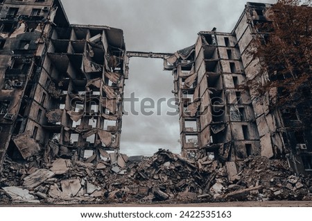 destroyed and burned houses in the city Russia Ukraine war Royalty-Free Stock Photo #2422535163