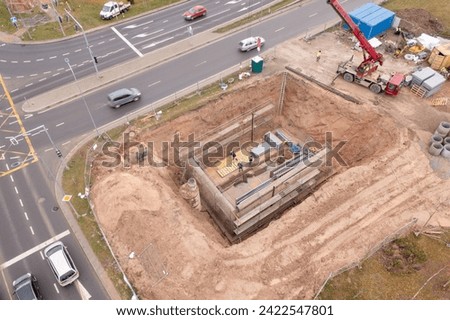 Drone photography of small construction site near road during autumn day