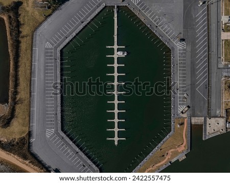A top down, drone view directly over an empty marina in Copiague, New York on Long Island on a sunny day. Royalty-Free Stock Photo #2422557475
