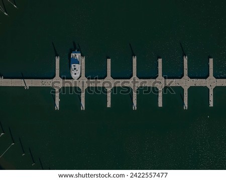 A top down, drone view directly over an empty marina in Copiague, New York on Long Island on a sunny day. Royalty-Free Stock Photo #2422557477
