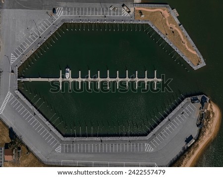 A top down, drone view directly over an empty marina in Copiague, New York on Long Island on a sunny day. Royalty-Free Stock Photo #2422557479