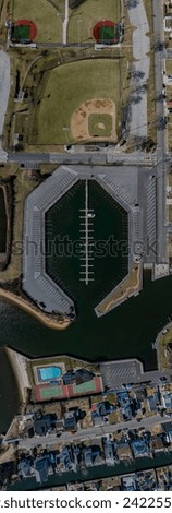 A top down, drone view directly over an empty marina in Copiague, New York on Long Island on a sunny day. Royalty-Free Stock Photo #2422557481