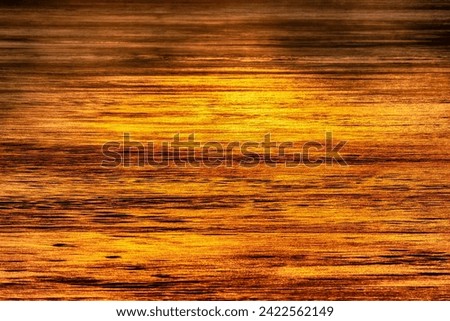 North-eastern European river after frosty winter. Ice began to melt, ice is saturated with meltwater. The morning sun colors the ice surface, a sunny path Royalty-Free Stock Photo #2422562149