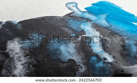 Draw abstract watercolor background. Macro view aquarelle stains and blobs color black blue grey on white paper. Watercolour mixing. Soft focus. film grain pixel texture. Defocused.
