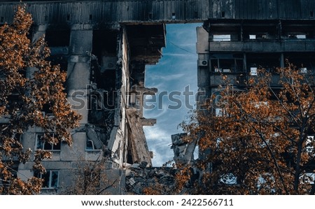 destroyed and burned houses in the city Russia Ukraine war Royalty-Free Stock Photo #2422566711