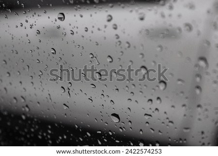 Rain drops in a mirror. Rain drops in rain season.