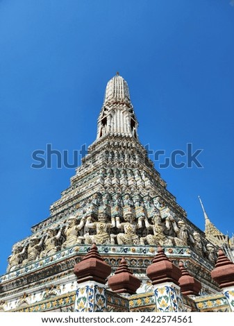 Wat Arun is one of the most famous landmarks in Bangkok. Located along the Chao Phraya River, it has the highest prang in Thailand. Royalty-Free Stock Photo #2422574561