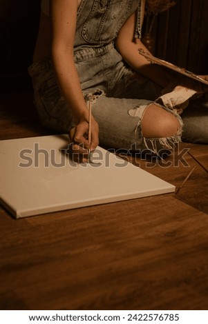 Female hands, woman painting a picture, doing a hobby, Hobby and leisure concept.Painting picture, hand painted lavend
