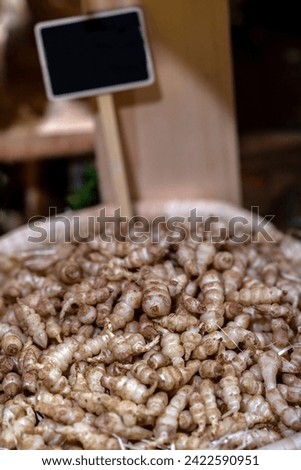 detail of the crosnes root with a sign