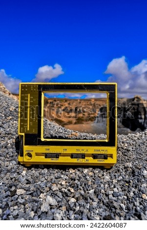 Conceptual Photo Picture of a Television Object in the Dry Desert