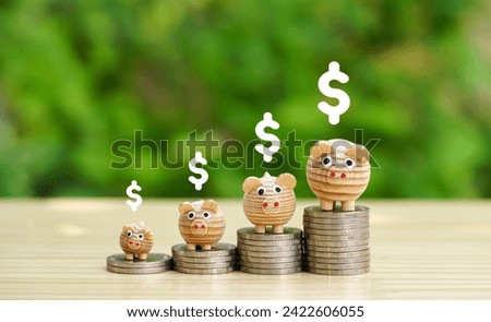 Money coins stacking as step stair with wooden piggy bank and dollars icon on natural background. Growing dollar investment strategy, growing banking concept for Financial idea.
