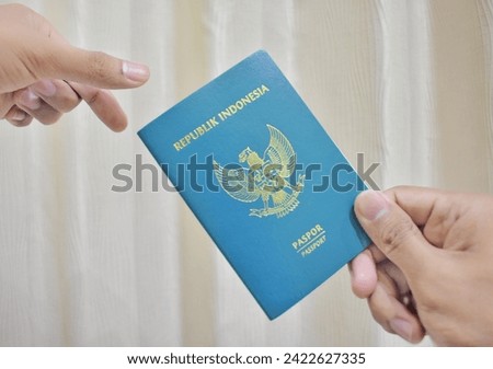 Banner with passport held in hand to give to airport officer on white and gold background. with travel documents. Identity, citizenship verification. Place for text. High quality photos