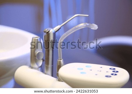 dentist tools and burnishers on a dentist chair in Dentist Clinic. Different dental instruments and tools in a dentists office. dentist and dental equipment in hospital	 Royalty-Free Stock Photo #2422631053