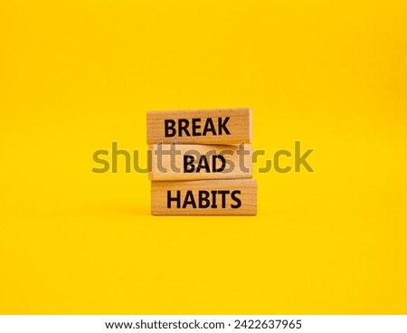 Break bad habits symbol. Concept words Break bad habits on wooden blocks. Beautiful yellow background. Medicine and Break bad habits concept. Copy space.