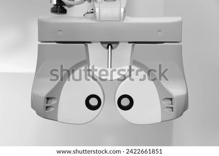 Phoropter, ophthalmic testing device machine, auto refractometer in modern ophthalmology clinic, eyesight test with modern equipment, ophthalmic testing device machine,optometrist tool.	 Royalty-Free Stock Photo #2422661851