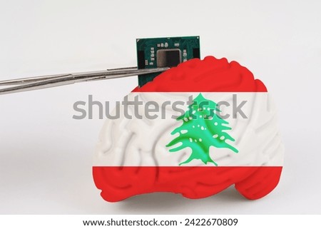 On a white background, a model of the brain with a picture of a flag - Lebanon, a microcircuit, a processor, is implanted into it. Close-up
