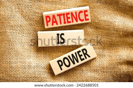 Patience is power symbol. Concept words Patience is power on beautiful wooden blocks. Beautiful canvas table canvas background. Business and patience is power concept. Copy space.