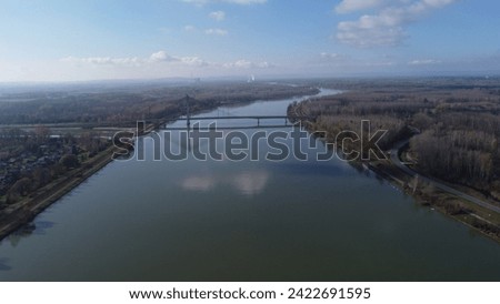 Drone picture of the Danube River in Lower Austria with a bridge in the center