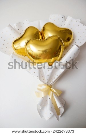 bouquet of gold foil hearts, heart balloons in a bouquet