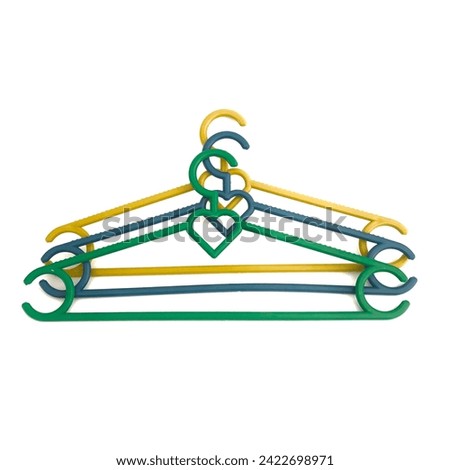 Three-color clothes hanger made of plastic material isolated on a white background