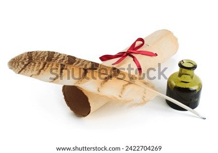Ancient paper scroll with feather and ink bottle isolated on a white background